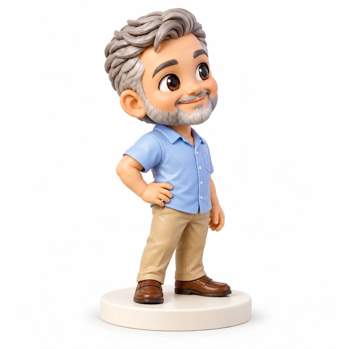 Side-oblique view of a silver-haired, bearded figurine in a pale-blue shirt and tan trousers, right hand on hip, standing on a cream base.